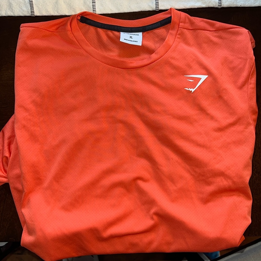 Men’s orange performance tee from gymshark